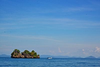 Scenic view of sea against blue sky