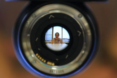 Woman photographing through camera