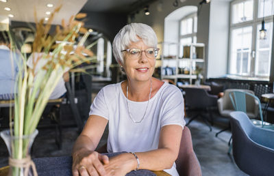 Portrait of woman sitting in office