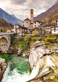 Bridge over river with mountain in background