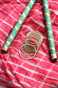 High angle view of bangles on fabric