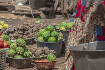 Vegetables for sale at market stall, lemons