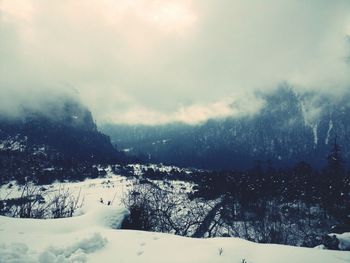 Scenic view of landscape against sky during winter