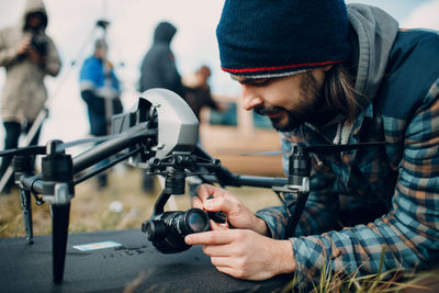 Young man photographing