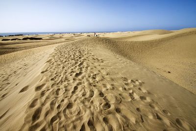 Footprints on sandy beach