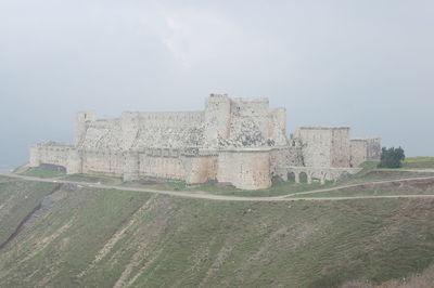 View of old ruin building against sky