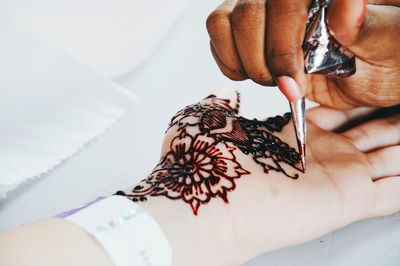 Close-up of henna design on hand