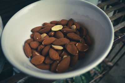 High angle view of almonds in bowl on table