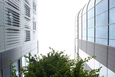 Low angle view of office building against sky