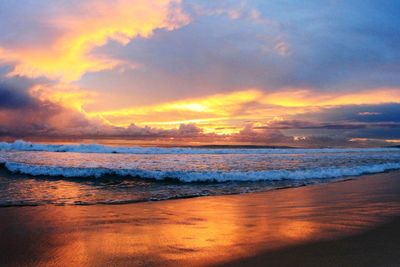 Scenic view of beach against sky during sunset