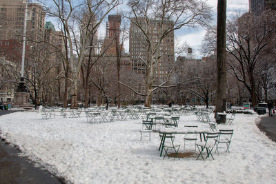 Empty benches in park during winter