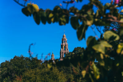 Temple against clear blue sky