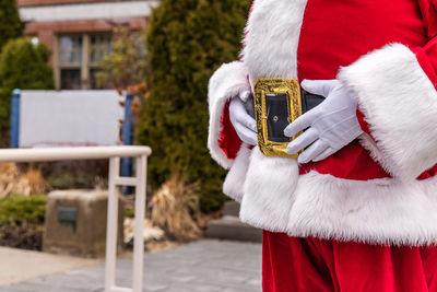 Rear view of woman wearing hat standing outdoors