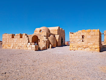 Old ruins against clear blue sky