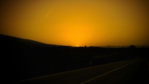 Scenic view of landscape at sunset