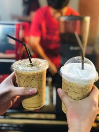 Close-up of hand holding ice cream