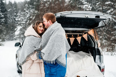 Portrait of young couple in snow