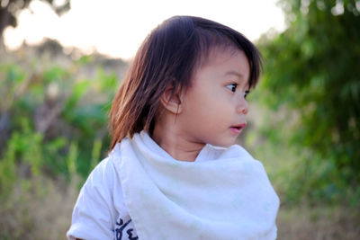 Portrait of cute girl looking away