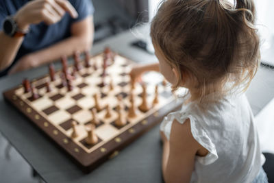 Close-up of boy playing chess