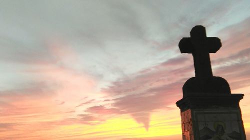 Low angle view of cloudy sky at sunset