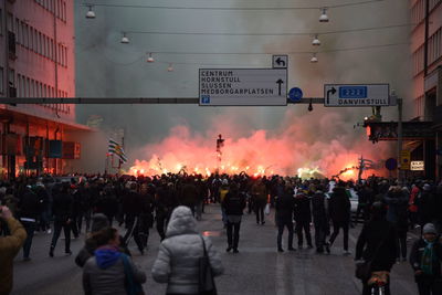 People protesting by fire on street