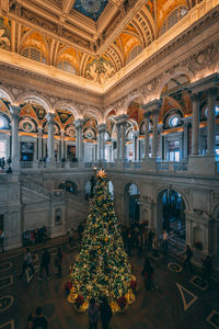 Group of people in illuminated christmas tree