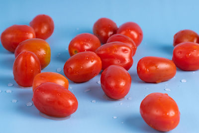 Close-up of tomatoes against blue background