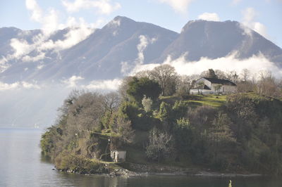 Scenic view of lake and mountains against sky