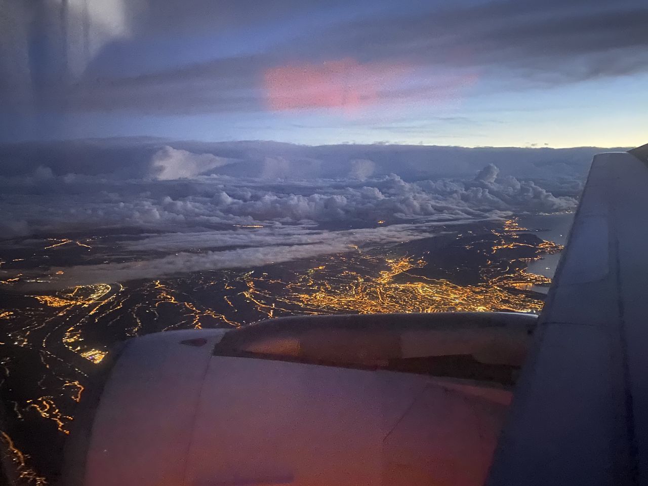 AERIAL VIEW OF AIRCRAFT WING AGAINST SKY