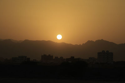 Scenic view of silhouette mountains against sky at night