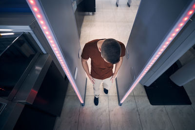 Low angle view of woman standing in building