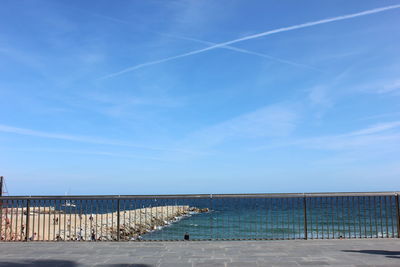 Scenic view of sea against blue sky
