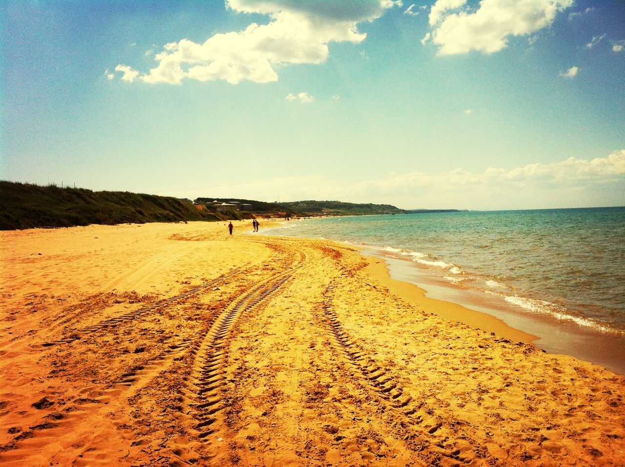 beach, sand, sea, shore, water, sky, tranquil scene, tranquility, horizon over water, scenics, beauty in nature, nature, incidental people, coastline, vacations, footprint, idyllic, cloud, tourism, cloud - sky