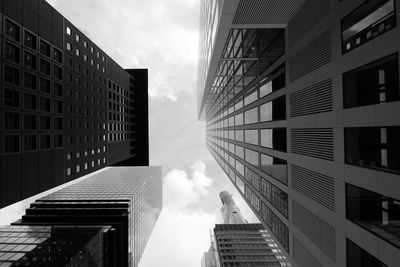 Directly below shot of modern buildings against sky