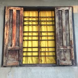 Closed window of old abandoned house