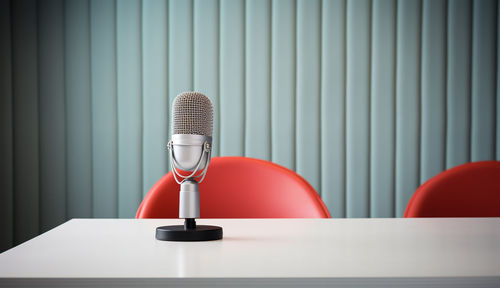 Close-up of microphone on table