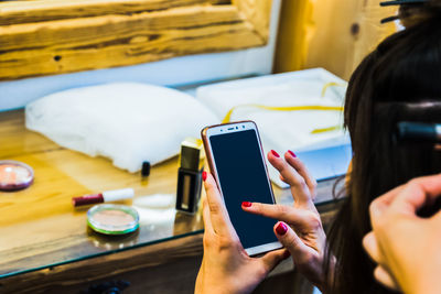 Midsection of man using mobile phone