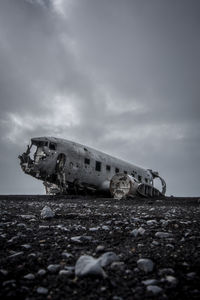 Abandoned airplane at beach