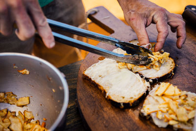 High angle view of person preparing food on table