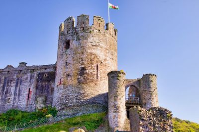 Low angle view of fort against blue sky