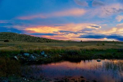 Scenic view of lake against sky during sunset