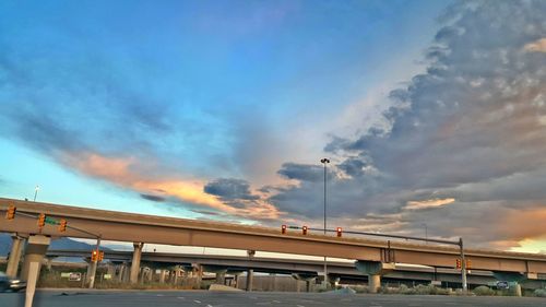 View of street light against cloudy sky