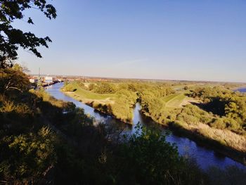 Scenic view of river amidst landscape against clear sky
