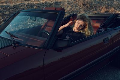 Young woman in car