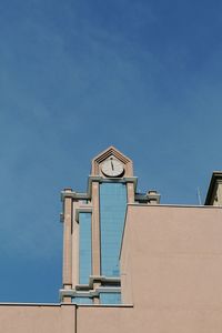 Low angle view of building against clear blue sky