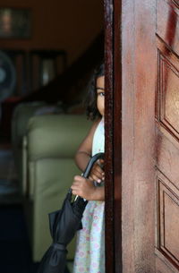 Close-up of woman standing on bench