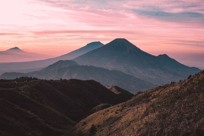 Scenic view of mountains against sky during sunset