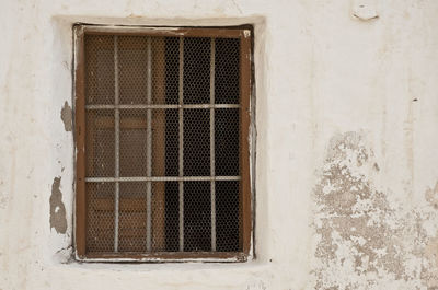 Low angle view of a window on an old building