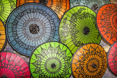 Directly above shot of multi colored umbrella at market stall