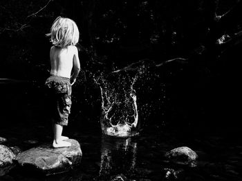 Full length of woman standing in water